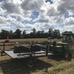 Tractor with hay on trailer